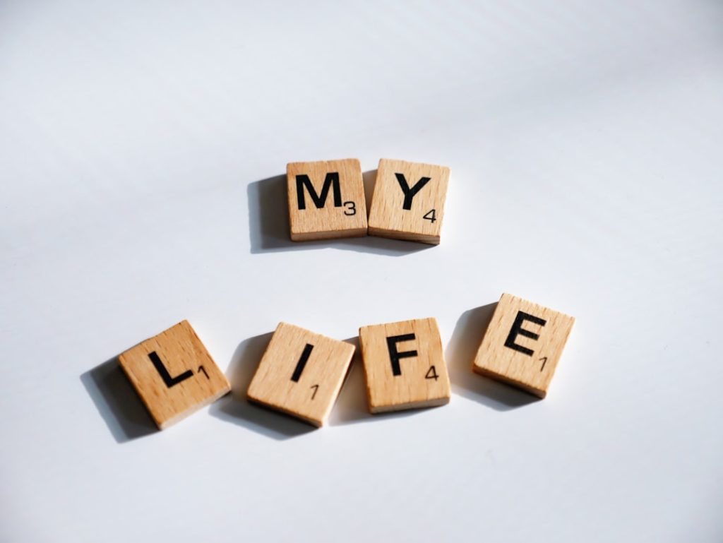 scrabbled wooden blocks spelling the word my life